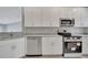 Modern kitchen features stainless steel appliances and beautiful granite countertops at 41 Peterlee Ct, Kissimmee, FL 34758