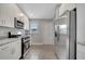 Well-equipped kitchen boasts stainless steel appliances, and granite countertops at 41 Peterlee Ct, Kissimmee, FL 34758