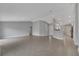 Open living space boasts tile flooring and neutral color palette at 41 Peterlee Ct, Kissimmee, FL 34758