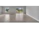 A spacious living room with ceramic tile floors, gray walls, and natural light at 41 Peterlee Ct, Kissimmee, FL 34758