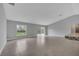 Open-concept living area with neutral paint, tile flooring, and natural light at 41 Peterlee Ct, Kissimmee, FL 34758