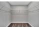 Walk-in closet with gray walls and wire shelving for optimal storage solutions at 41 Peterlee Ct, Kissimmee, FL 34758