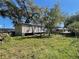 A single-story house with a grassy backyard at 413 4Th St, Orlando, FL 32824