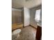 A modest bathroom with a shower-tub combination and vinyl floors at 413 4Th St, Orlando, FL 32824