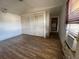 Bedroom features hardwood floors, closet and bright light from the window at 413 4Th St, Orlando, FL 32824