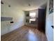 Bedroom with hardwood floors and bright light from the window at 413 4Th St, Orlando, FL 32824