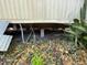 View of the home's foundation and the surrounding landscaping at 413 4Th St, Orlando, FL 32824
