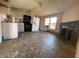 Open concept kitchen with modern appliances and a rustic brick fireplace at 413 4Th St, Orlando, FL 32824