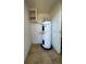 Enclosed water heater with tile floors and a storage shelf above at 413 4Th St, Orlando, FL 32824