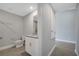 Bathroom featuring a granite countertop vanity and a toilet, with tiled flooring at 43 Peterlee Ct, Kissimmee, FL 34758