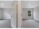 Bedroom features neutral walls, gray carpet flooring and natural light from the window at 43 Peterlee Ct, Kissimmee, FL 34758