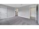 Large bedroom with carpet flooring and access to bathroom and closet at 43 Peterlee Ct, Kissimmee, FL 34758