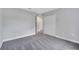 Bright bedroom featuring neutral walls, carpet flooring, and a spacious closet at 43 Peterlee Ct, Kissimmee, FL 34758