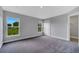 Spacious bedroom with large windows and a walk-in closet entrance at 43 Peterlee Ct, Kissimmee, FL 34758