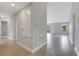 Hallway with tile flooring, leading to an open area with a window view of the exterior at 43 Peterlee Ct, Kissimmee, FL 34758