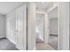 Hallway features neutral walls, carpet flooring, and white doors leading to various rooms at 43 Peterlee Ct, Kissimmee, FL 34758
