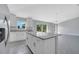 Open concept kitchen with granite countertops overlooking the living and dining areas at 43 Peterlee Ct, Kissimmee, FL 34758