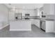 Modern kitchen featuring white cabinets, stainless steel appliances, and granite countertops at 43 Peterlee Ct, Kissimmee, FL 34758