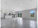 Spacious open floor plan featuring a modern kitchen with stainless steel appliances at 43 Peterlee Ct, Kissimmee, FL 34758