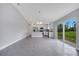 An open floor plan flows into the kitchen with stainless steel appliances at 43 Peterlee Ct, Kissimmee, FL 34758
