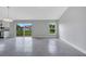 Open-concept living area featuring sliding glass doors leading to the backyard at 43 Peterlee Ct, Kissimmee, FL 34758