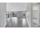 Bright, open-concept living area featuring tile floors and sliding glass doors at 43 Peterlee Ct, Kissimmee, FL 34758