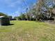 Backyard featuring shed with an expansive grassy area at 430 Connecticut Ave, St Cloud, FL 34769