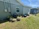 Exterior home shot with AC unit sitting on manicured lawn at 430 Connecticut Ave, St Cloud, FL 34769