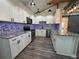 Modern kitchen featuring white cabinets, stainless steel appliances, and eye-catching backsplash and countertops at 430 Connecticut Ave, St Cloud, FL 34769