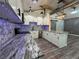 Updated kitchen featuring granite counters, mosaic backsplash, stainless appliances, and an island with room for seating at 430 Connecticut Ave, St Cloud, FL 34769