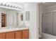 A bright bathroom with a well-lit vanity and a shower-tub combo awaits at 4925 Poolside, St Cloud, FL 34769