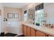 Bright bathroom featuring a double vanity, garden tub and black and white decor at 4925 Poolside, St Cloud, FL 34769