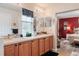 Bright bathroom features a double sink vanity and opens to red bedroom at 4925 Poolside, St Cloud, FL 34769