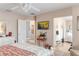 Spacious bedroom featuring TV, ensuite bath and adjoining rooms at 4925 Poolside, St Cloud, FL 34769