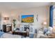 Cozy living room with a fireplace, plush seating and a flatscreen tv at 4925 Poolside, St Cloud, FL 34769