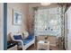 Cozy reading nook featuring an inviting white wicker seat at 4925 Poolside, St Cloud, FL 34769