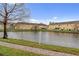 Beautiful pond view with yellow buildings, landscaping, and a serene setting at 4925 Poolside, St Cloud, FL 34769