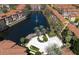 Stunning aerial view of a community featuring a large lake with a fountain and lush landscaping at 6153 Metrowest Blvd # 103, Orlando, FL 32835