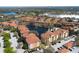 Overhead view of the apartment complex with a central lake and fountain, surrounded by mature trees at 6153 Metrowest Blvd # 103, Orlando, FL 32835