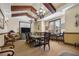 Traditional dining room featuring a large dining table, decorative chandeliers and beautiful exposed beams at 6153 Metrowest Blvd # 103, Orlando, FL 32835