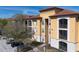 Attractive apartment building showing detailed stonework, private balconies, and manicured landscaping at 6153 Metrowest Blvd # 103, Orlando, FL 32835