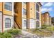 Charming condo exterior showing walkways, patios, and lush landscaping in a well maintained community at 6153 Metrowest Blvd # 103, Orlando, FL 32835
