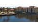 Lovely apartment complex with a lake view, palm trees, and stunning architecture at 6153 Metrowest Blvd # 103, Orlando, FL 32835