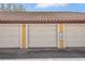 Exterior shot of condo garages with red tile roofing at 6153 Metrowest Blvd # 103, Orlando, FL 32835