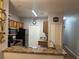 A well lit kitchen features stainless steel appliances, neutral countertops, and convenient pantry access at 6153 Metrowest Blvd # 103, Orlando, FL 32835