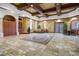 Grand lobby featuring travertine floors, coffered ceilings, and elegant decor at 6153 Metrowest Blvd # 103, Orlando, FL 32835