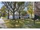 Beautiful community park with grill, picnic benches and a scenic lake backdrop at 6153 Metrowest Blvd # 103, Orlando, FL 32835