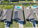 Aerial view of a home with solar panels and a private pool at 649 Meadow Pointe Dr, Haines City, FL 33844