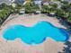 Large community pool with ample seating and shaded areas for residents to enjoy at 649 Meadow Pointe Dr, Haines City, FL 33844