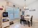Cozy dining area with natural light and a charming tablecloth at 649 Meadow Pointe Dr, Haines City, FL 33844